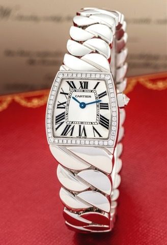 CARTIER LA DONA.DIAMOND AND WHITE GOLD.Cartier, 'La Dona', case No. 97200MX, Ref. 2905. Made circa 2007..Very fine and elegant, lady's 18K white gold and diamond set.quartz wristwatch with integral S-link 18K white gold Cartier.bracelet with concealed dou