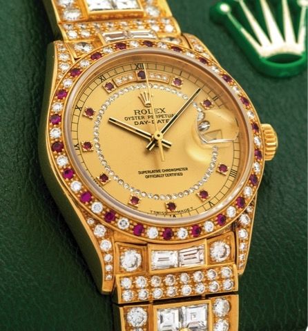 ROLEX REF. 18148 GURU OSHO'S CUSTOMIZED DAY-DATE.DIAMOND RUBY YELLOW GOLD.Rolex, Oyster Perpetual, Day-Date, Superlative Chronometer Officially Certified, case No. 8652207.Ref. 18148/18000. Made in 1984..Fine and exotic, self-winding, water-resistant, 1
