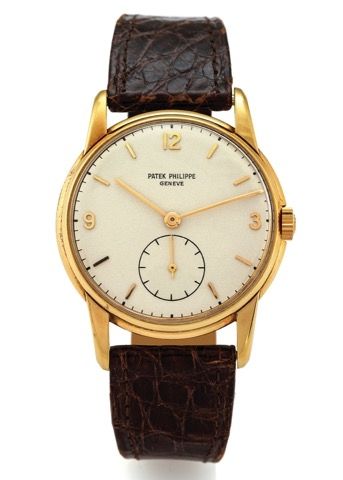 PATEK PHILIPPE REF. 1569 YELLOW GOLD.Patek Philippe, Genève, movement No. 938682, case No..671459, Ref. 1569. Made circa 1945..Fine and rare, 18K yellow gold wristwatch with an 18K yellow.gold buckle.