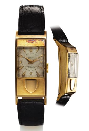 ROLEX REF. 3361 PRINCE DRIVER'S WATCH YELLOW GOLD.Rolex, Prince Officially Certified Chronometer, movement No. T94122.Ref. 3361. Made in circa 1940..Very fine and rare, rectangular curved, asymmetrical, center seconds.18K yellow gold driver's wristwatch.