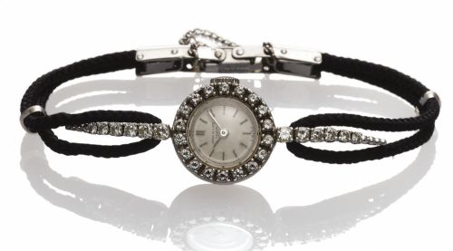 PATEK PHILIPPE REF. 3267 LADY'S PLATINUM.DIAMOND.Patek Philippe, Genève, movement No. 980969, case No. 2616753, Ref. 3267/12..Made in 1960..Very fine and rare, platinum, diamond-set lady's wristwatch with cord bracelet.
