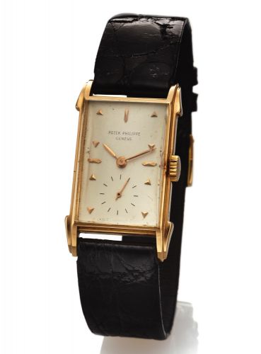 PETEK PHILIPPE REF. 2416 PINK GOLD.Patek Philippe Cie, Genève, No. 973907, case No..512576. Made in 1951..Fine and rare, rectangular, 18K pink gold wristwatch with an 18K pink gold Patek Philippe buckle.