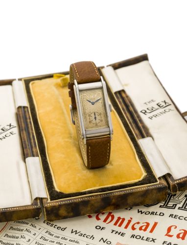 ROLEX "PRINCE RAILWAY" Rolex "Prince Railway", Ref. 1768. Case No. 019784. Made in 1938.. Fine and rare, rectangular curved, stainless steel gentleman's Art Deco wristwatch. Accompanied by the original fitted box and the original Rolex timing certificate.
