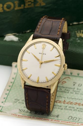 ROLEX, REF 7002, PRESENTATION WATCH, GOLD FILLED Rolex, Automatic, case No. 13132, Ref. 7002. Made for the U.S. market in 1966 for industrial presentations. Fine and rare, center seconds, self-winding, 14K gold-filled wristwatch. Accompanied by a fitted b