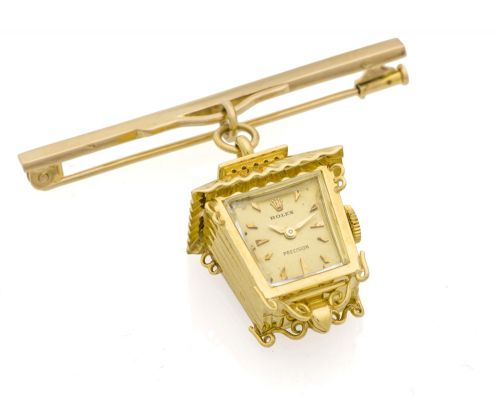 ROLEX REF. 8784, LANTERN PENDANT Rolex, "Precision", Ref. 8784. Made in the 1950s. Fine and unusual, 18K yellow gold keyless lady's pendant watch designed as a small lantern.