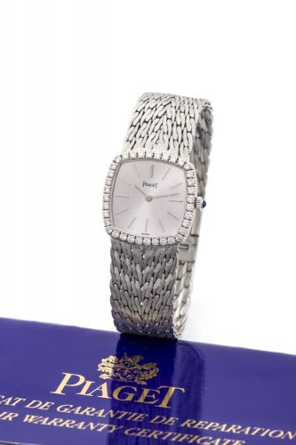 PIAGET REF. 9236, WHITE GOLD AND DIAMOND Piaget, No. 3111242, case No. 202259, Ref. 9236. Made in the 1980's. Fine and elegant, 18K white gold and diamonds lady's wristwatch with an integral 18K white gold Piaget bracelet. Accompanied by a Piaget pouch an