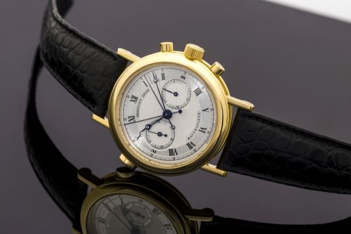 BREGUET REF. 3947 - RATTRAPANTE YELLOW GOLD Breguet, "Rattrapante", No. 2838I, Ref. 3947. Made in the late 1990s. Very fine and rare, 18K yellow gold wristwatch with round and oval button split-seconds chronograph, register and an 18K yellow gold Breguet 