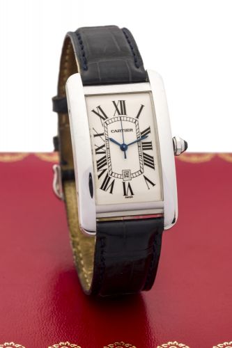 CARTIER TANK AMERICAINE, WHITE GOLD Cartier, "Tank Americaine,", case No. 262094CD, Ref. 1741. Made in the 1990s Very fine, rectangular curved, center seconds, self- winding, water-resistant, 18K white gold wristwatch with date and an 18K white gold Carti
