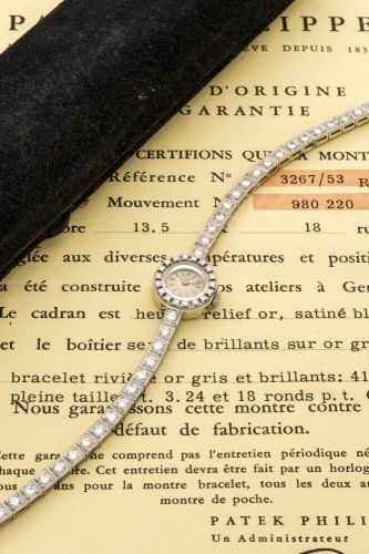 PATEK PHILIPPE REF. 3267/53 DIAMOND BEZEL BRACELET WHITE GOLD Patek Philippe, Geneve, No. 980220, Ref. 3267/53. Sold in February 1960. Fine and very rare, 18K white gold lady's wristwatch with diamond set bezel and integral bracelet set. Accompanied wit