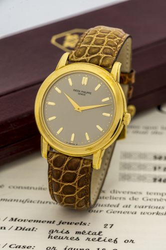 PATEK PHILIPPE REF. 5032 YELLOW GOLD Patek Philippe, Genève, movement No. 1200296, Ref. 5032J. Sold in February 2006. Very fine and elegant, self-winding, water-resistant, 18K yellow gold wristwatch with an 18K yellow gold Patek Philippe buckle. Accompani