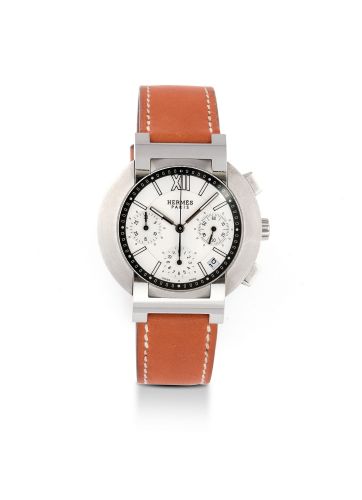 HERMES NOMADE CHRONOGRAPH STEEL Hermès Nomade chronograph, no. 01/910 ref. 1688139. Made circa 2000 Fine,quartz,water-resistant,stainless steel wristwatch with date,restangularButton chronograph,registered and stailess steel deployant clasp. Beau chronogr