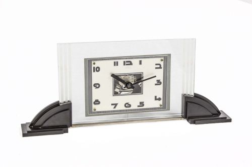 ATO ART DECO ELECTRIC DESK CLOCK CHROME METAL Ato, Desk clock. Made in1930`s Fine and rare chromed metal and bakelit elctric mechanical desk clock Designby Leon HATOT. Dessinée par Léon HATOT cette pendule éelectro-mécanique est lancée parune pile située 