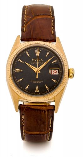 ROLEX REF. 4467, OYSTER PERPETUAL - SO-CALLED "OVETTONE" Very fine and rare, center-seconds, self-winding, water-resistant, tonneau-shaped, 18K pink gold wristwatch with date.