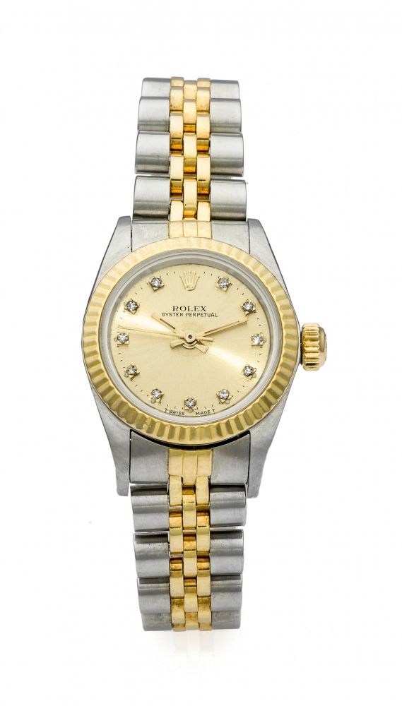 ROLEX OYSTER PERPETUAL LADY'S REF. 67193 YELLOW GOLD AND STEEL Fine, self-winding, 18K yellow gold and stainless steel lady's wristwatch with diamond-set dial.
