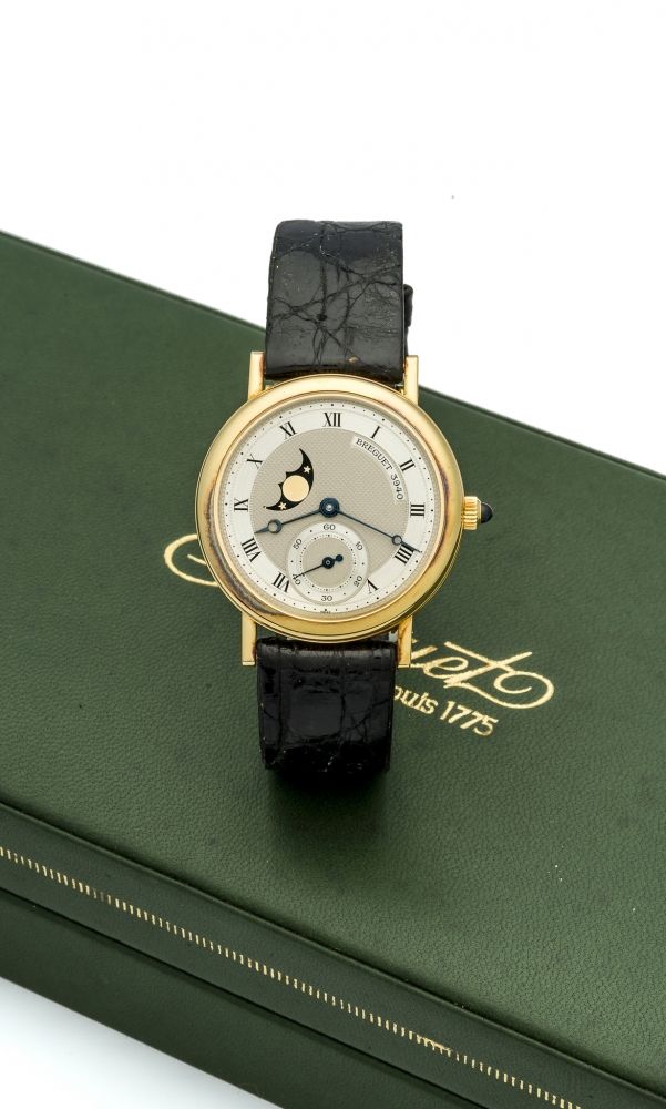 BREGUET REF. 3280 LADY'S MOON PHASES YELLOW GOLD Fine and rare, manual-winding, 18K yellow gold lady's wristwatch with moon phases.