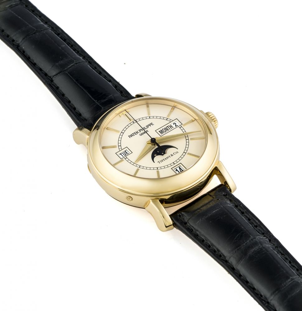 PATEK PHILIPPE RETAILED BY TIFFANY REF. 5150 "T150" ANNUAL CALENDAR YELLOW GOLD LIMITED EDITION Very fine and rare, self-winding, 18K yellow gold wristwatch with annual calendar and moon phases.