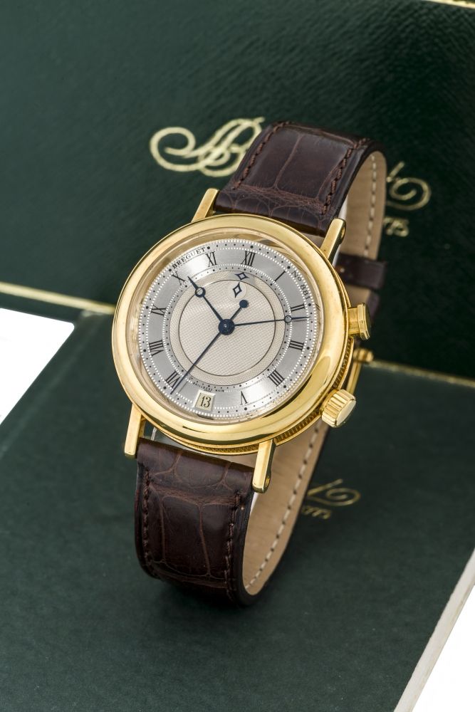 BREGUET, REF. 3600, ALARM A fine, self-winding, 18k yellow gold wristwatch with inner rotating alarm disk.