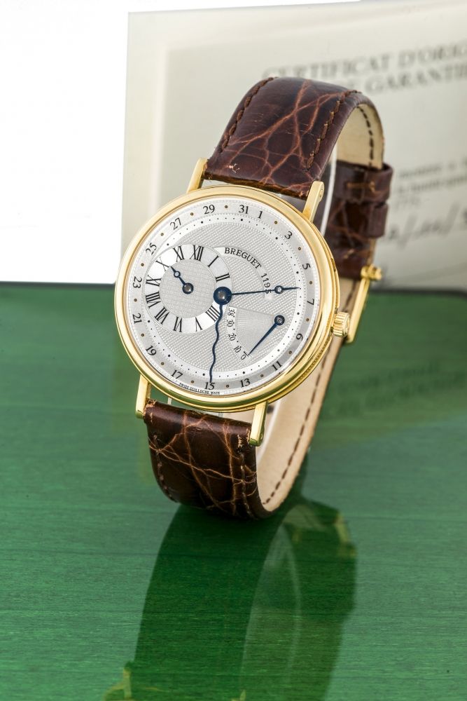 BREGUET, REF. 3680, POWER RESERVE A very fine, self-winding, 18k yellow gold wristwatch with regulator type dial, date and power reserve.