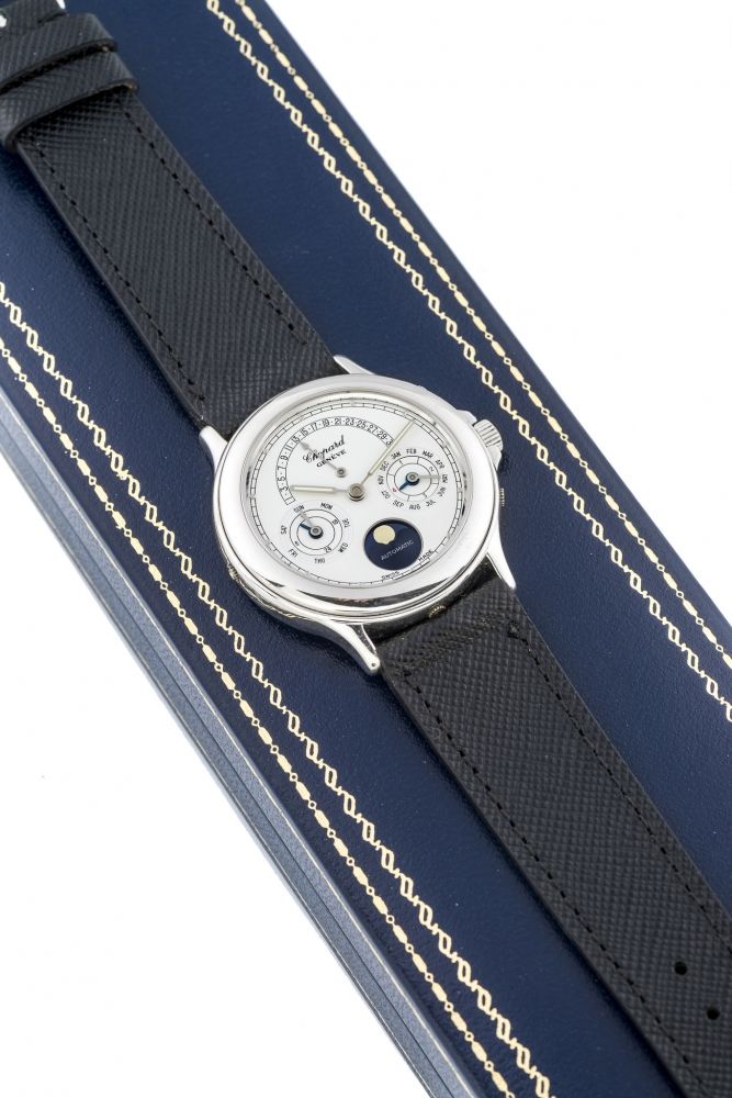 CHOPARD, LUNA D'ORO, RETROGRADE PERPETUAL CALENDAR, WHITE GOLD A fine and rare, self-winding, 18k white gold perpetual calendar wristwatch with retrograde date. Rare montre bracelet automatique en or blanc avec calendrier perpétuel et date retrograde.