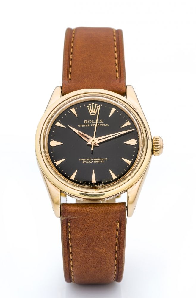 ROLEX, REF. 6548, OYSTER PERPETUAL A fine and very rare, small, self-winding, 18k pink gold wristwatch with black dial.