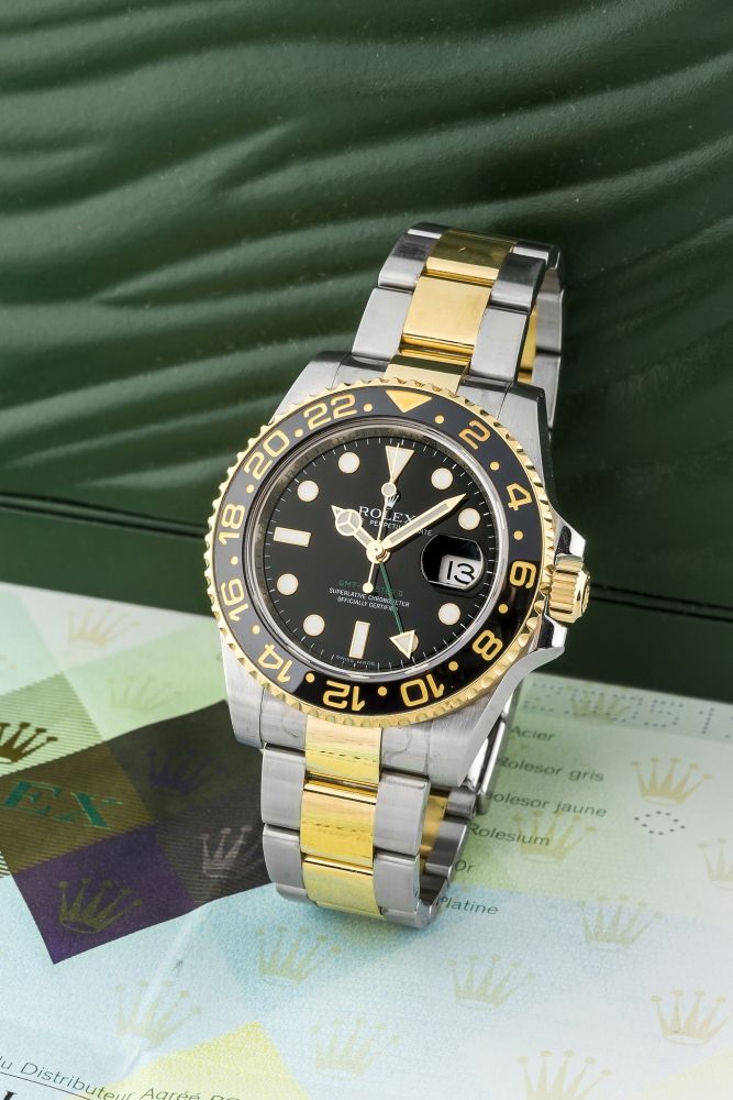 ROLEX, REF. 116713, GMT MASTER II A fine, self-winding, stainless steel and gold GMT wristwatch.