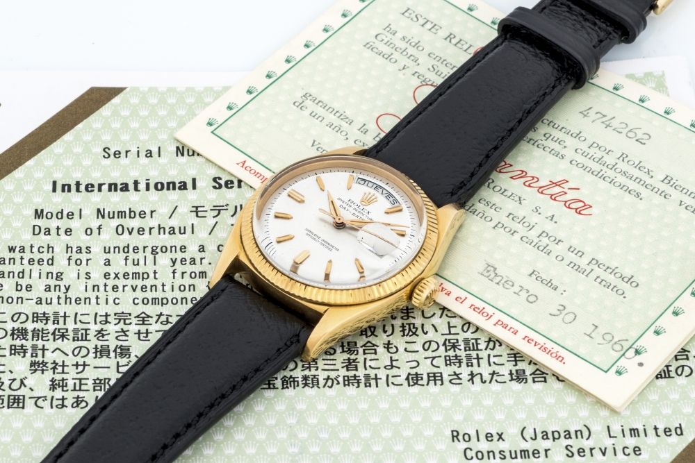 ROLEX, REF. 6611 OYSTER PERPETUAL DAY-DATE Fine and rare, self-winding, yellow gold day-date wristwatch with silver dial.