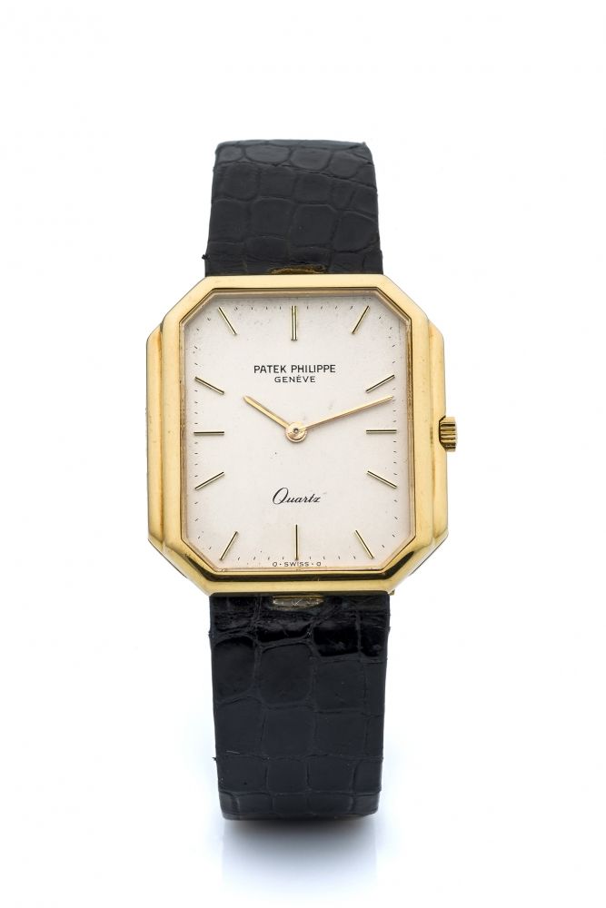 PATEK PHILIPPE, REF. 3853, QUARTZ A fine and unusual, quartz, 18k yellow gold wristwatch.