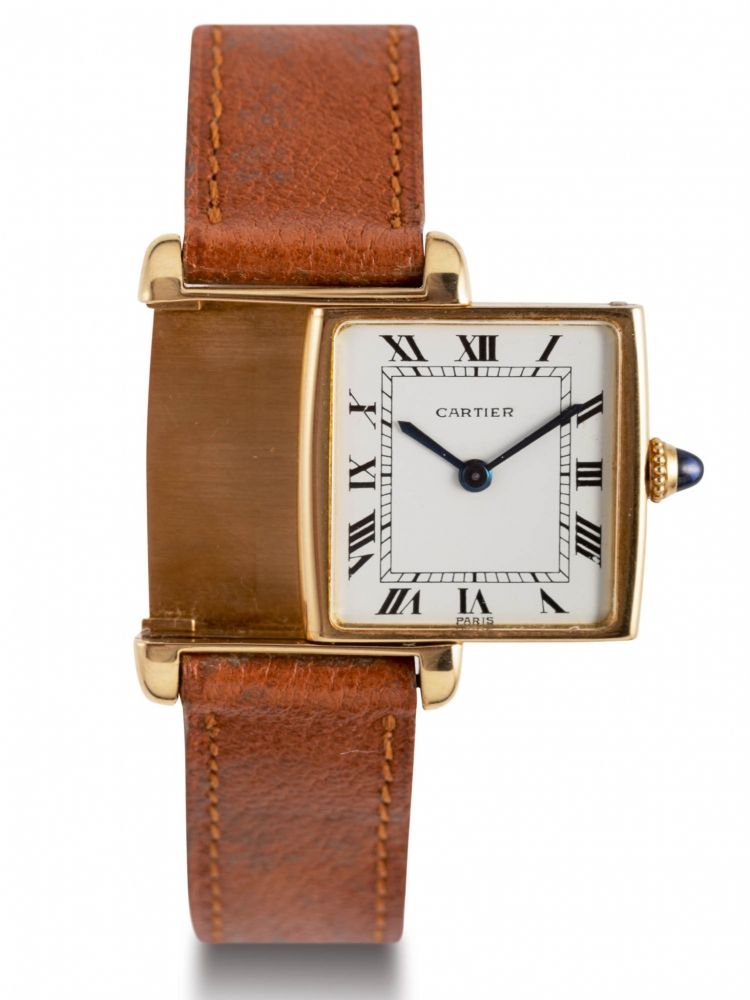 CARTIER REVERSO YELLOW GOLD Fine and rare 18k yellow-gold rectangular reversible manual winding wristwatch with white dial and blue hands. Belle et rare montre-bracelet en or jaune 18k. Bo îtier rectangle réversible. Couronne de remontoir sertie d'un cabo