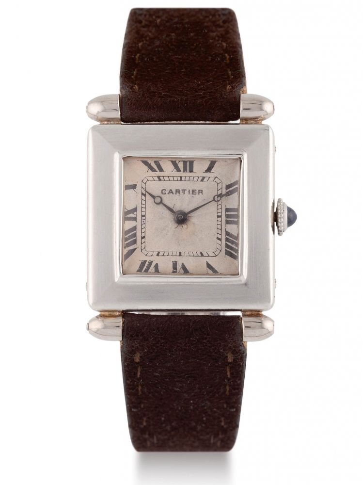 CARTIER TANK OBUS, PLATINUM Very fine and rare platinum Cartier "Tank obus " with silver "rayon de soleil" dial. Très belle et rare montre Bracelet 'Tank Obus' en platine. Cadran rayon de soleil. Mouvement mécanique pour European Watch Clock Co.