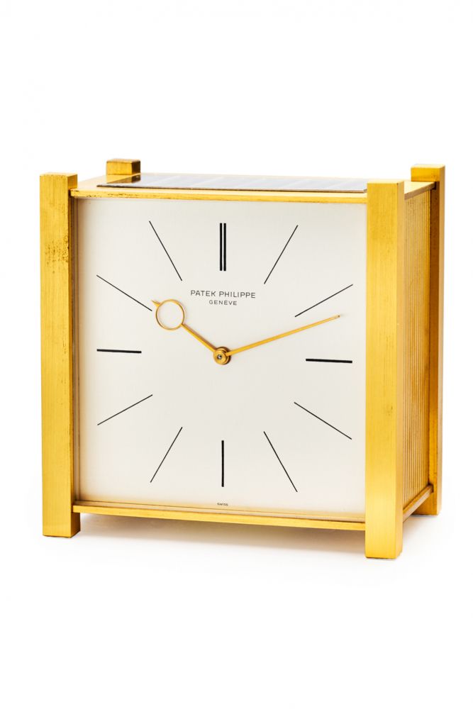 PATEK PHILIPPE REF. 919 E, MECHANICAL SOLAR-POWERED TABLE CLOCK. GILDED BRASS