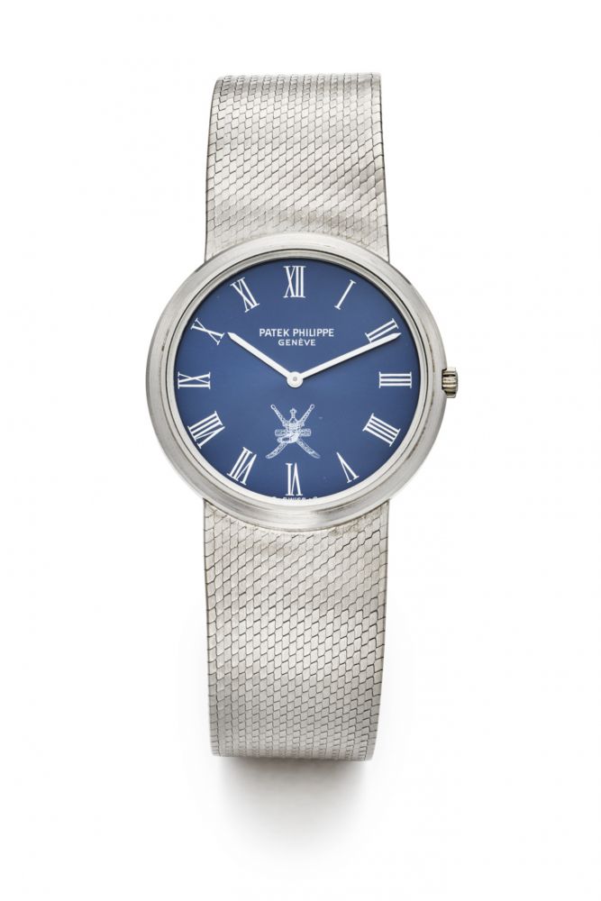 PATEK PHILIPPE REF. 3601-1, “OMAN” OR “KHANJAR CREST” BLUE DIAL, INTEGRATED BRACELET. 18K WHITE GOLD