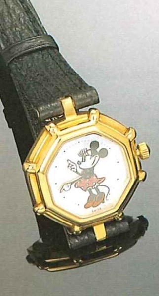 G_rald Genta Minnie, Ref. 2899.7, present.series..Fine and amusing octogonal,l8ct gold Iady's.wristwatch with fitted box.