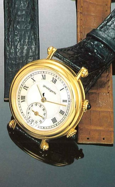 G_rald Genta, Ref. 3257.7, present series..Fine and unusual two time-zone, self-winding, 18ct.gold gentleman's wristwatch with two crowns and.fitted box.