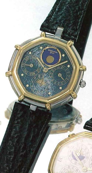 G_rald Genta, Ref. 2859.4, present series..Fine octogonal, astronomic, two time-zone,18ct.gold and stainless steel gentleman's wristwatch.with double date and moon phases, and fitted box.