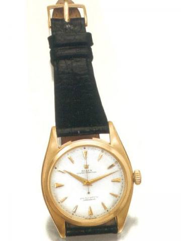 Rolex Oyster Perpetual, Officially Certified Chronometer, Ref. 6088. Produced in the 1950's..Fine tonneau-shaped, center-seconds, self-winding, water-resistant, 18K pink gold gentleman's wristwatch.