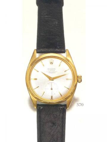 Rolex Oyster Veriflat, Officially Certified Chronometer, Ref. 6512. Produced in the 1960's..Very fine and rare, flat, water-resistant, tonneau-shaped, 18K yellow gold gentleman's wristwatch with a yellow gold-plated Rolex buckle.