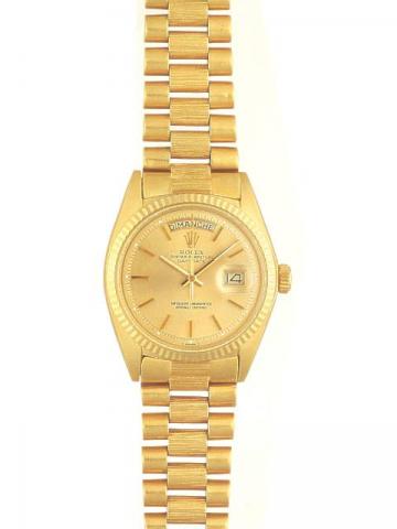 Rolex Oyster Perpetual Day-Date Superlative Chronometer Officially.Certified, Ref. 1800. Produced in the 1970's..Very fine, center-seconds, self-winding, water-resistant, tonneau-shaped, 18K yellow gold gentleman's wristwatch with date and day, and with 1