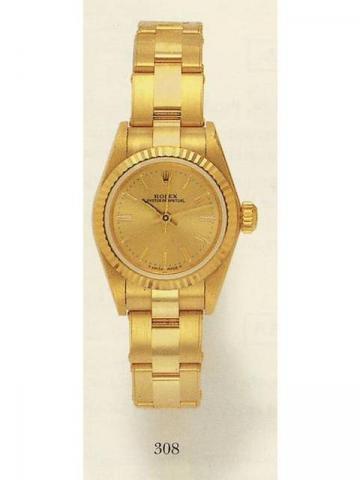 Rolex Oyster Perpe-tual, Ref. 67198. Pro-duced in the 1990's.Fine and rare, center-seconds, self-winding, water-resistant, 18K yellow gold lady's wristwatch with an 18K yellow gold Oyster bracelet.