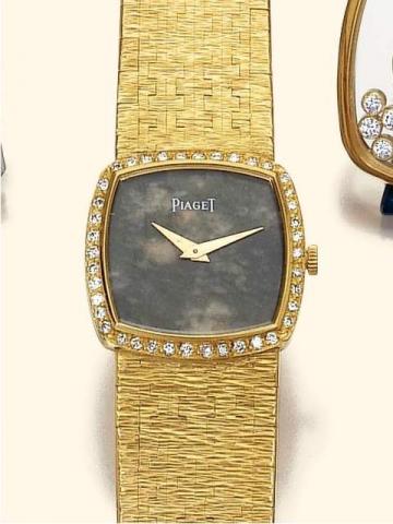 Piaget, No.176158, Ref. 9231 A6. Produced in 1969.Very fine, cushion-shaped, 18K yellow gold and diamond lady's wristwatch with a guilloch_ tiled 18K yellow gold bracelet.