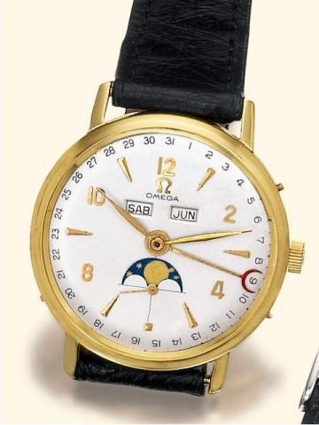 Omega Cosmic, Ref. 1011. Produced in the 1940's.Fine astronomic, 18K yellow gold gentleman's wristwatch, with triple date calendar, moon phases and gold-plated Omega buckle.