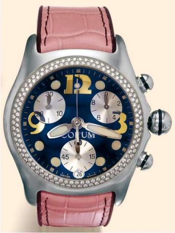 Corum, Bubble _ Boutique, Ref. 396.150.20. Produced in 2001..Fine and unusual, curved, water-resistant, stainless steel and diamonds, unisex quartz wristwatch with round button chronograph, registers and date, a thick domed crystal creating a lens effect,