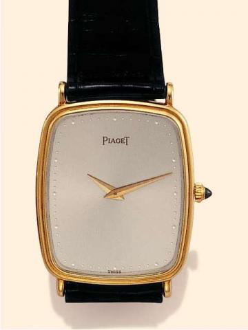 Piaget, Ref. 92538. Produced in the 1980's..Fine and elegant, thin, rectangular galb_, 18K yellow gold gentleman's wristwatch with an 18K yellow gold Piaget buckle.