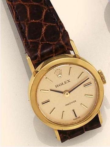 Rolex Precision, Ref. 2642. Produced in the 1960's..Fine, 18K yellow gold lady's wristwatch with a Rolex buckle.