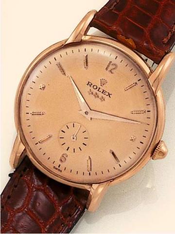 Rolex, Ref. 4635. Produced in the 1950's..Fine, 18K pink gold gentleman's wristwatch with a Rolex buckle.