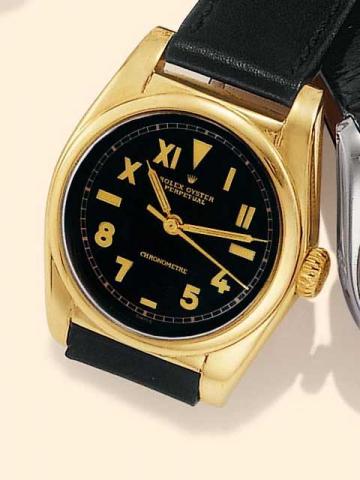 Rolex Oyster, Perpetual, Chronometer, Ref. 6050. Produced in the 1950's.Fine, tonneau-shaped, center-seconds, self-winding, 14K yellow gold gentleman's wristwatch.