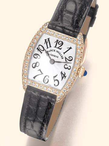 Frank Muller, Cintr_e Curvex, No. 04, Ref. 2251 QZD. Produced in the 1990's.Fine, tonneau-shaped, 18K pink gold and diamonds lady's quartz wristwatch with an 18K pink gold Franck Muller buckle set with 4 diamonds. Accompanied by a thuja root wooden fitted
