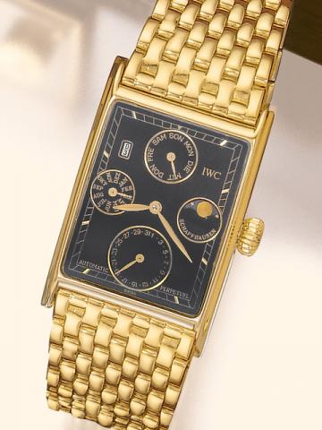 International Watch Co., Schaffhausen, Novecento Automatic Perpetual, case No. 2452924, Ref. 9235. Produced in the 1990's.Very fine, rectangular, astronomic, self-winding, water-resistant, 18K yellow gold gentleman's wristwatch with secular perpetual cale
