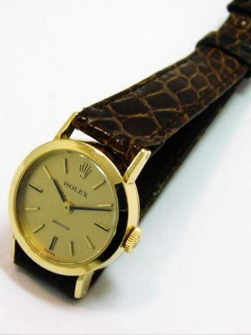 Rolex Precision, Ref. 2642. Produced in the 1960's. Fine, 18K yellow gold lady's wristwatch with a Rolex buckle.