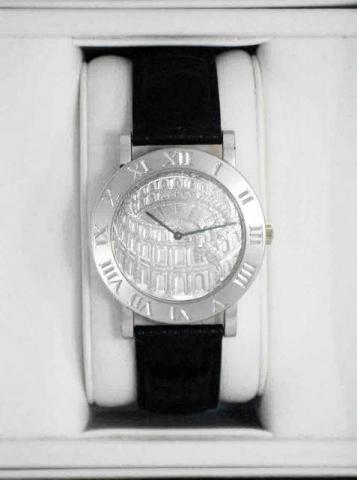 Corum, Romulus Coliseum, No. X, Ref. 587.09.59. Produced in 1997 in three series of 100 examples each, in yellow, pink and white gold. Sold on January 15, 2003..Extremely fine and rare, self-winding, water-resistant, 18K white gold gentleman's wristwatch 