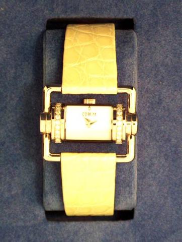 Corum, Ref. 130.330.47. Produced in the 1990's, sold on January 15, 2003. Very fine and unusual, semi-cylindrical, stainless steel and diamond driver's quartz wristwatch with two extended tubular mobile lugs forming a horizontal rectangle and a stainless 